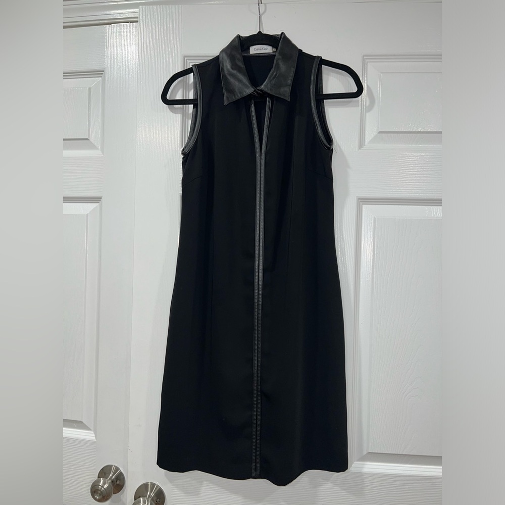 Calvin Klein sheath dress. Sleeveless with faux leather trim.